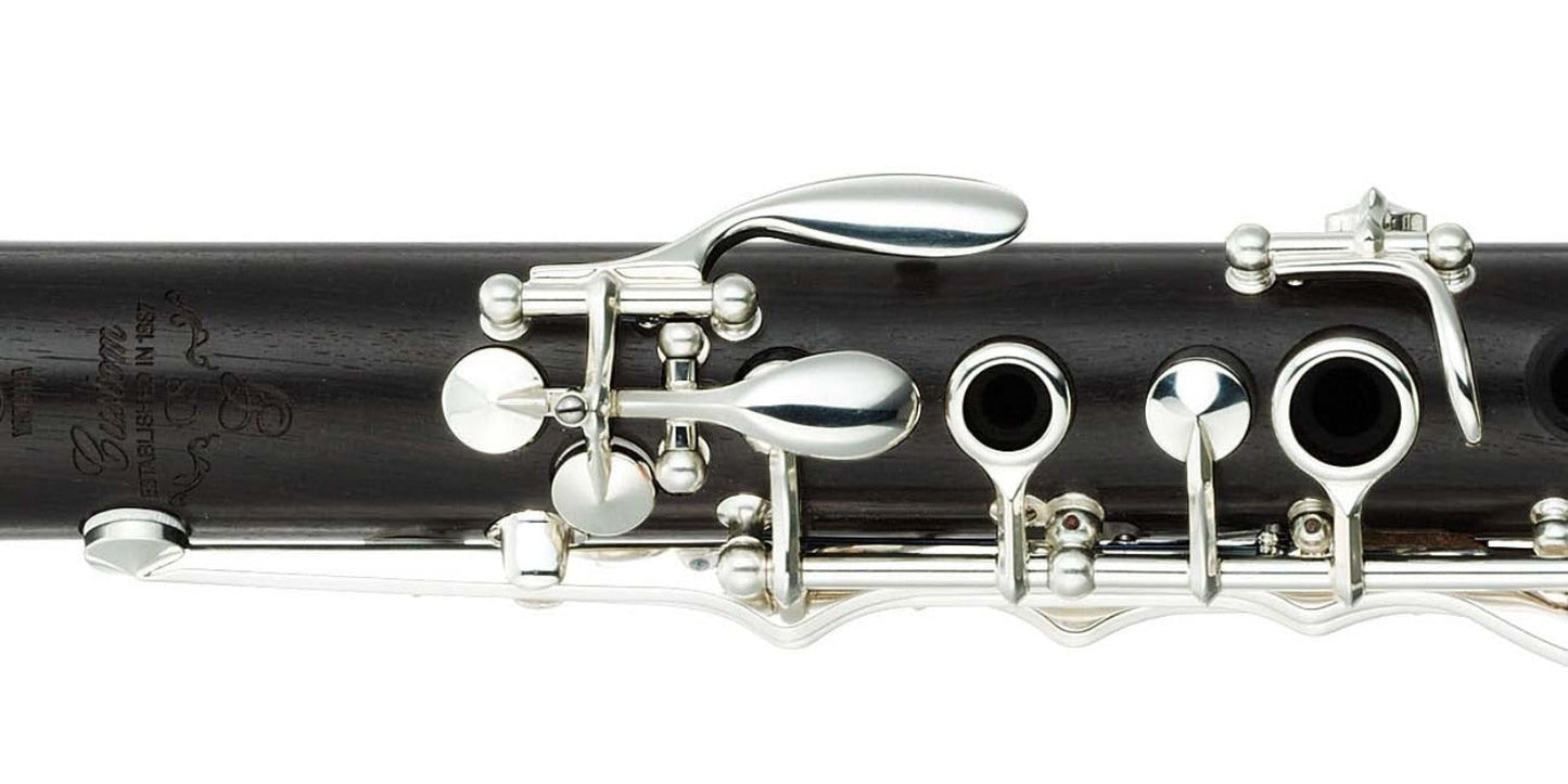 closeup of upper joint, showing logo engraving, G sharp and A keys, and LH 1 and 2 rings, on white background