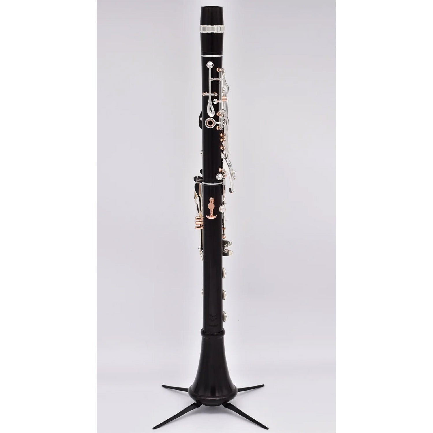 full rear shot of Firebird clarinet assembled on a stand, against white background