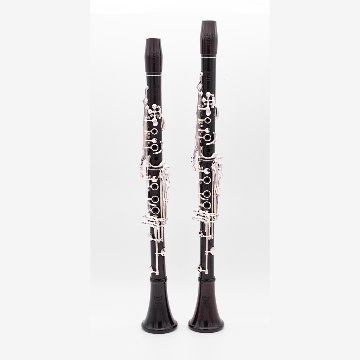 Full length shot of Royal Global Classical Limited Bb and A clarinets on a light gray background