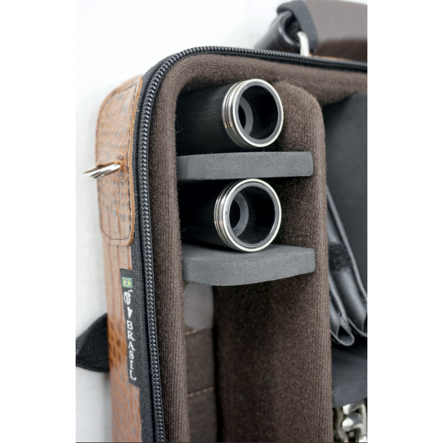 closeup of corner storage for 2 extra barrels in brown double bonna case