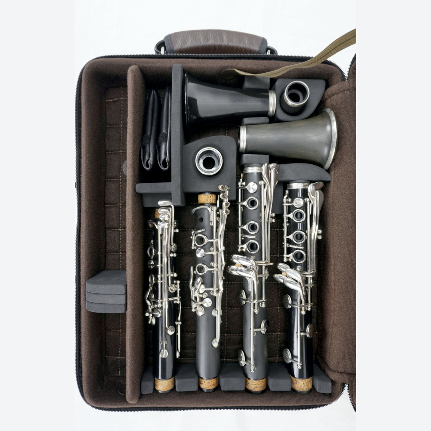 brown NYCW Bonna double case open to show a pair of clarinets nested inside, on a white background