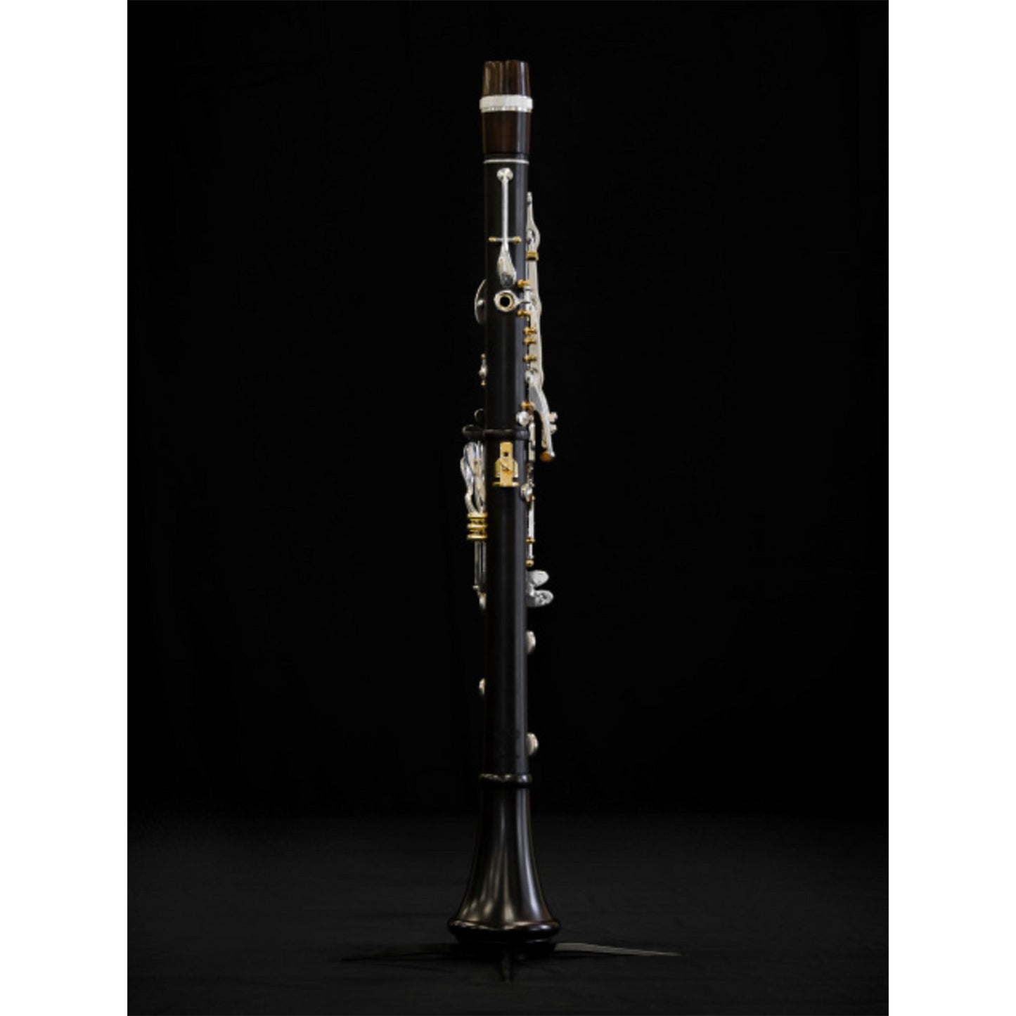 Full rear view of assembled Polaris clarinet on stand, with black background